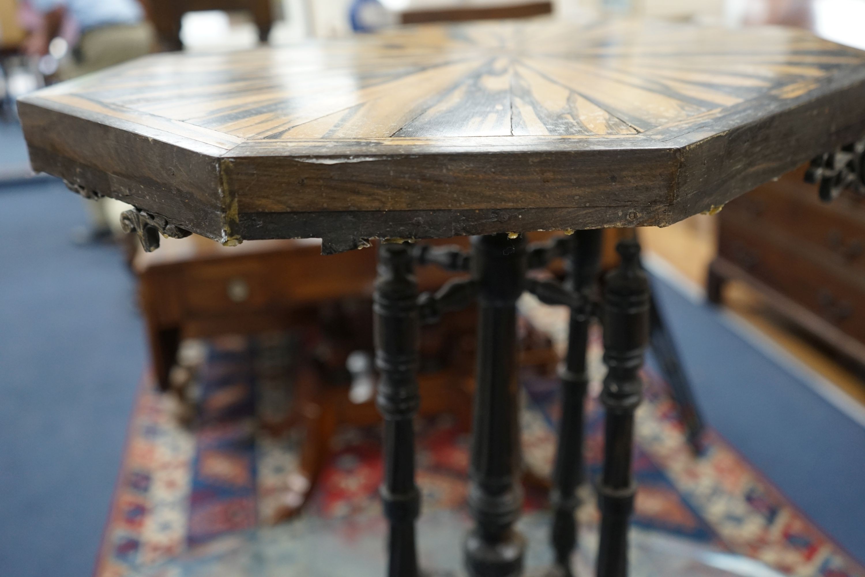 A 19th century Celanese carved ebony and coromandel veneered octagonal occasional table, width 57cm, depth 42cm, height 70cm